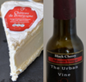 a wedge of Chateau de Bourgogne cheese with a bottle of cherry balsamic vinegar