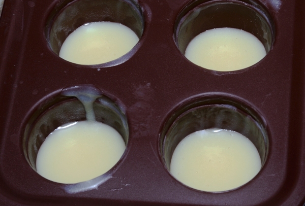 melted white chocolate ganache poured into silicone mold