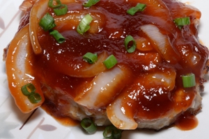 A dish containing Chinese Style Pork Chops in Sweet Onion Sauce